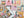 Jigsaw puzzle with a colorful book-themed design on a matching out of focus background of the completed puzzle
