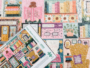 Jigsaw puzzle with a colorful book-themed design on a matching out of focus background of the completed puzzle