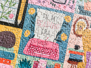 Colorful puzzle with a typewriter and 'In My Reading Era' text