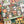 A 500-piece jigsaw puzzle box by Spaghetti Tree, featuring a colorful Day of the Dead/Halloween illustration with sugar skulls, jack-o'-lanterns, butterflies, and candles, shown resting on a matching patterned puzzle surface.