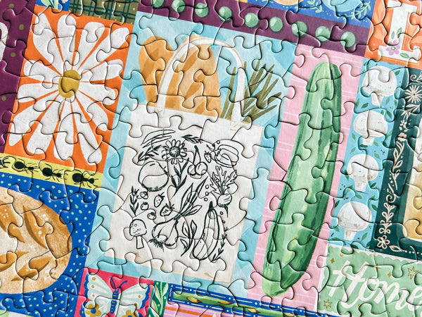 Colorful puzzle with floral and food-themed pieces.