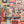 A 1000-piece jigsaw puzzle box titled by Spaghetti Tree puzzles featuring a colorful collage of Halloween-themed illustrations like pumpkins, ghosts, houses, and 'Happy Halloween' signs, set atop an out of focus shot of the completed puzzle.