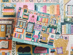 Puzzle box with colorful design featuring books and a cat, set against a a out of focus version of the completed puzzle in the background.
