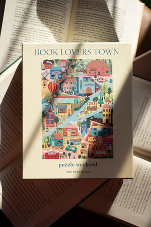 Puzzle box titled 'Book Lovers Town' on top of an open book