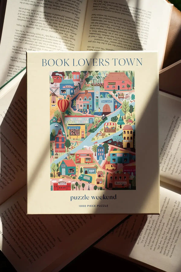 Puzzle box titled 'Book Lovers Town' on top of an open book