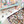Puzzle with pieces spilling out of a box on a white surface