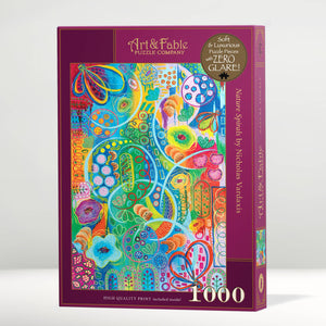 Jigsaw puzzle box with colorful abstract design and 'Art & Fable' branding on a white background