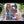 YouTube video of a top down view time lapse of the Cat Lady jigsaw puzzle being put together on a white desk surrounded by plants.